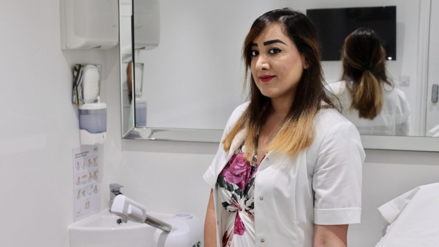 Beauty therapist in a treatment room at Ray Cochrane Beauty Aesthetics Academy