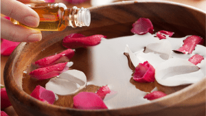 Hot oil in a bowl with flower petals