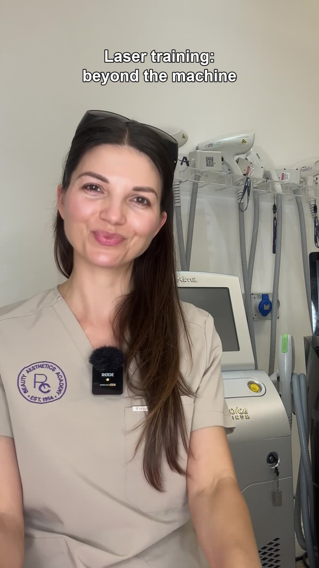 Eleonora Androva beside laser and IPL equipment at Ray Cochrane Academy